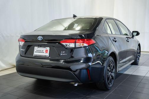 Midnight Black Metallic 2025 Toyota Corolla Hybrid LE