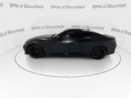 Black Sapphire Metallic 2024 BMW M4 Competition xDrive
