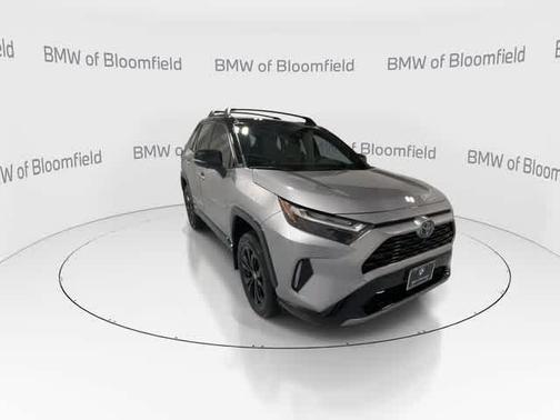 Silver Sky Metallic/Midnight Black Metallic 2024 Toyota RAV4 Hybrid SE
