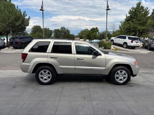 Tan 2010 Jeep Grand Cherokee Laredo
