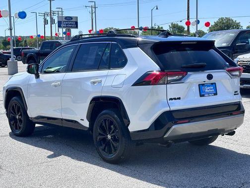 Wind Chill Pearl/Midnight Black Metallic 2024 Toyota RAV4 Hybrid SE