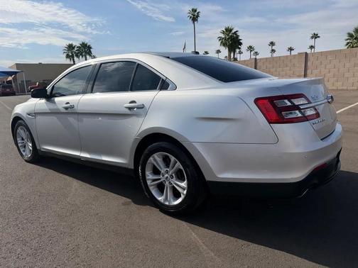 Red 2016 Ford Taurus SEL FWD