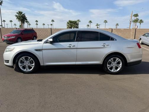 Red 2016 Ford Taurus SEL FWD