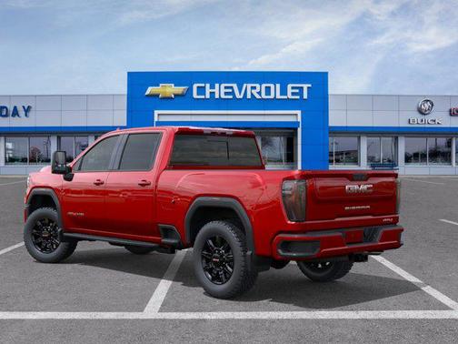 Volcanic Red Tintcoat 2026 GMC Sierra 3500 AT4