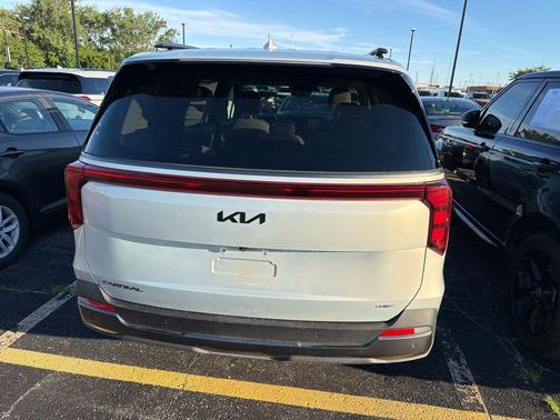 Ivory Silver 2025 Kia Carnival Hybrid SX