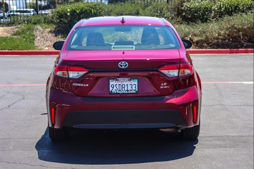 Ruby Flare Pearl 2025 Toyota Corolla Hybrid LE