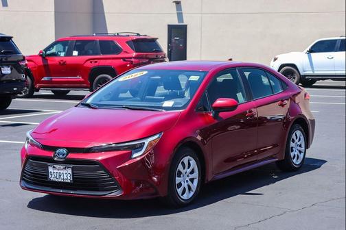 Ruby Flare Pearl 2025 Toyota Corolla Hybrid LE