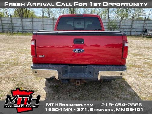 Red 2010 Ford F-250 Lariat