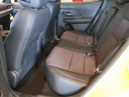 Yellow 2026 Nissan Kicks SR