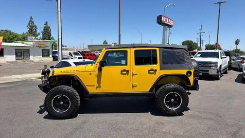 Yellow 2011 Jeep Wrangler Unlimited Rubicon