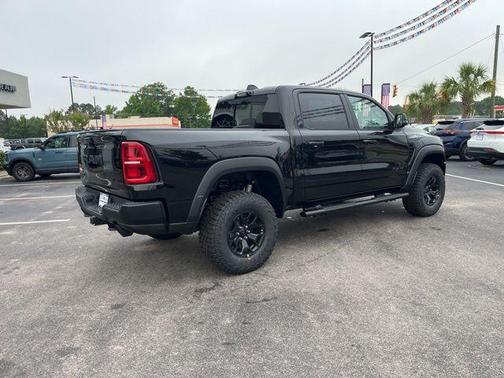 Diamond Black Crystal Pearlcoat 2026 RAM 1500 RHO Crew Cab 4x4 5'7' Box