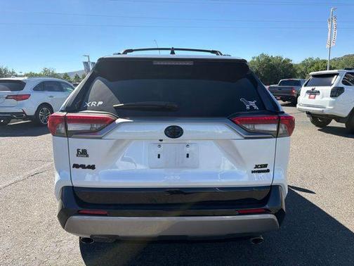 Wind Chill Pearl/Midnight Black Metallic 2023 Toyota RAV4 Hybrid SE