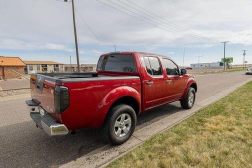 Red Brick 2010 Nissan Frontier SE