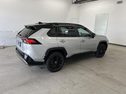 Silver Sky Metallic/Midnight Black Metallic 2024 Toyota RAV4 Hybrid SE