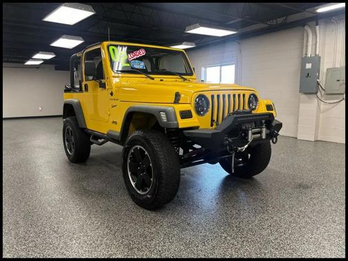 Yellow 2002 Jeep Wrangler Sport