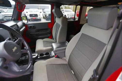 Red 2010 Jeep Wrangler Unlimited Sport