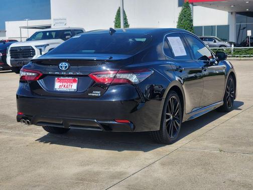 Midnight Black Metallic 2024 Toyota Camry Hybrid SE