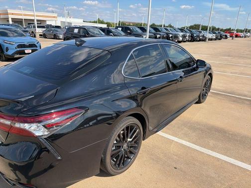 Midnight Black Metallic 2024 Toyota Camry Hybrid SE