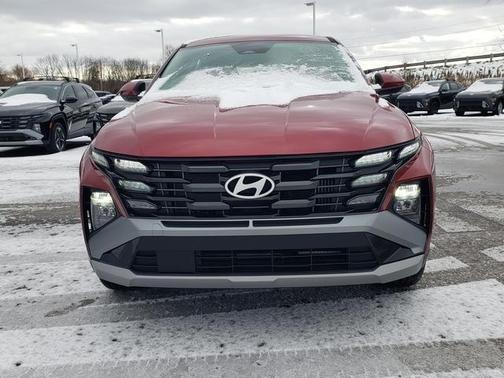 Red 2026 Hyundai TUCSON Hybrid Blue SE