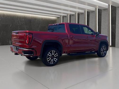 Volcanic Red Tintcoat 2025 GMC Sierra 1500 AT4