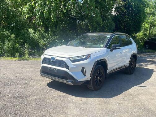 Wind Chill Pearl/Midnight Black Metallic 2024 Toyota RAV4 Hybrid SE