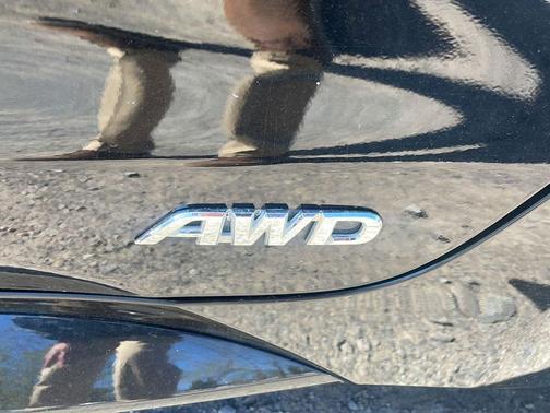 Midnight Black Metallic 2024 Toyota Corolla Hybrid SE