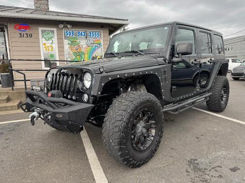 Black 2014 Jeep Wrangler Unlimited Sahara