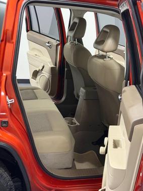 Orange 2008 Jeep Compass Sport