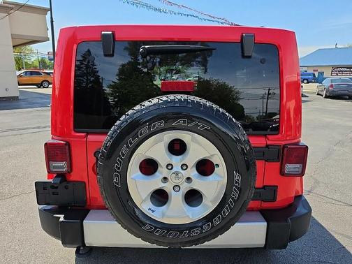 Red 2013 Jeep Wrangler Unlimited Sahara