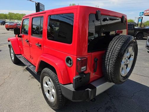 Red 2013 Jeep Wrangler Unlimited Sahara