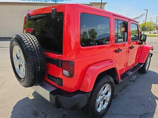 Red 2013 Jeep Wrangler Unlimited Sahara