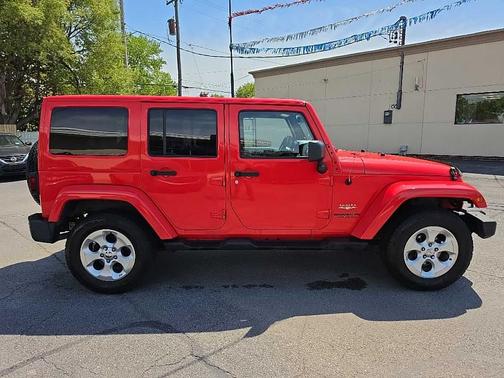 Red 2013 Jeep Wrangler Unlimited Sahara