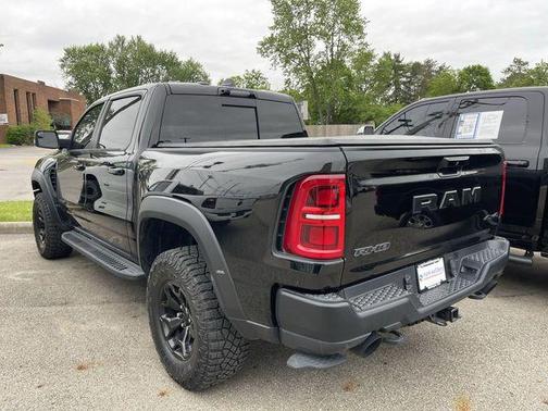 Diamond Black Crystal Pearlcoat 2025 RAM 1500 RHO Crew Cab 4x4 5'7' Box
