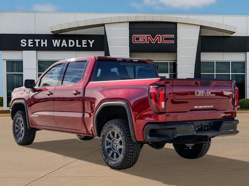 Volcanic Red Tintcoat 2026 GMC Sierra 1500 AT4X