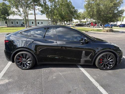 Solid Black 2025 Tesla Model Y Performance Dual Motor All-Wheel Drive