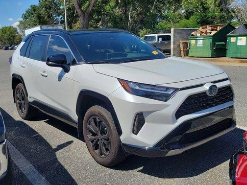 Wind Chill Pearl/Midnight Black Metallic 2024 Toyota RAV4 Hybrid SE