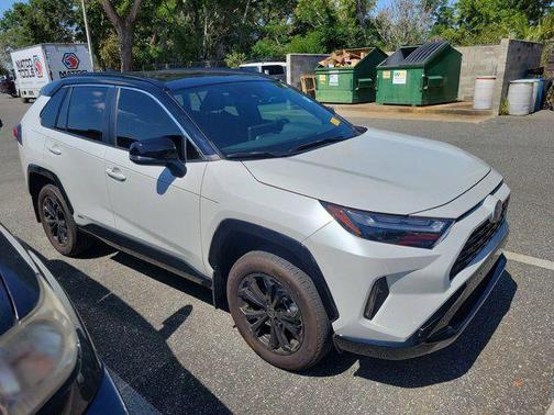 Wind Chill Pearl/Midnight Black Metallic 2024 Toyota RAV4 Hybrid SE