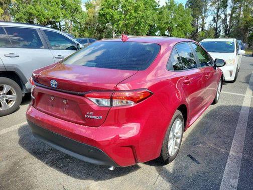 Ruby Flare Pearl 2024 Toyota Corolla Hybrid SE
