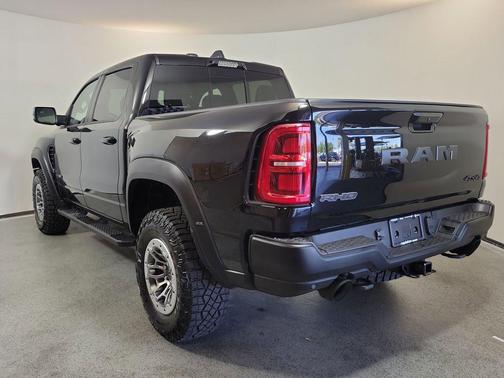 Diamond Black Crystal Pearlcoat 2026 RAM 1500 RHO Crew Cab 4x4 5'7' Box