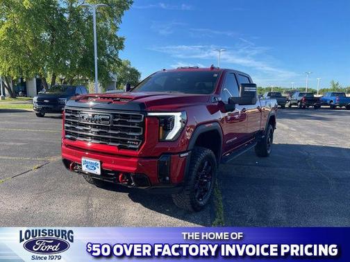 Volcanic Red Tintcoat 2026 GMC Sierra 2500 AT4