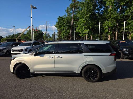 Ivory Silver 2025 Kia Carnival SX Prestige