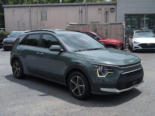 Cityscape Green 2023 Kia Niro Plug-In Hybrid EX