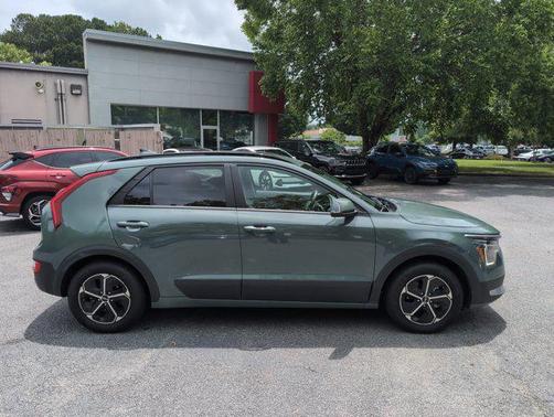 Cityscape Green 2023 Kia Niro Plug-In Hybrid EX