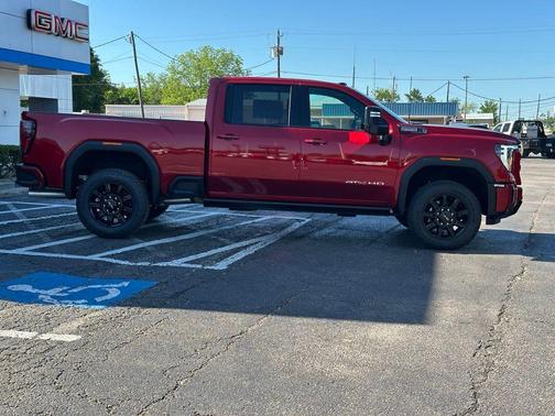 Volcanic Red Tintcoat 2026 GMC Sierra 2500 AT4