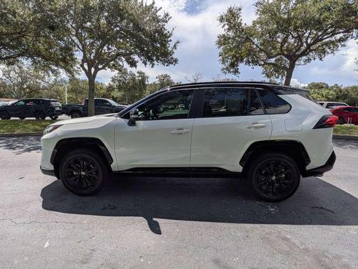 Wind Chill Pearl/Midnight Black Metallic 2023 Toyota RAV4 Hybrid SE