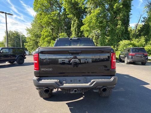 Diamond Black Crystal Pearlcoat 2026 RAM 1500 RHO Crew Cab 4x4 5'7' Box