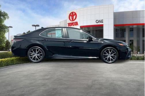 Midnight Black Metallic 2024 Toyota Camry Hybrid SE
