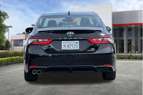Midnight Black Metallic 2024 Toyota Camry Hybrid SE