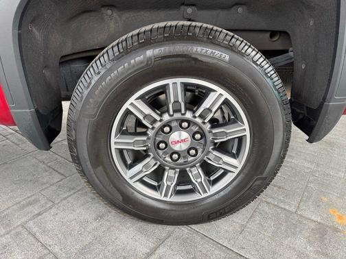 Volcanic Red Tintcoat 2025 GMC Sierra 1500 AT4