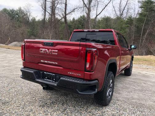 Volcanic Red Tintcoat 2026 GMC Sierra 1500 AT4X